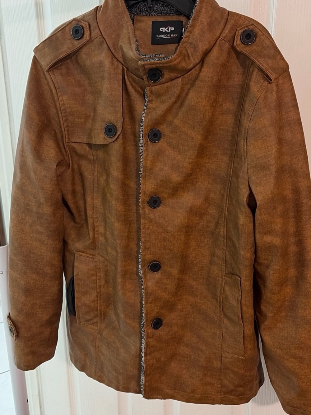 Brown faux leather jacket with fur inside